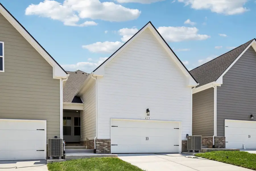 Front exterior of a new home in Cedars of Cane Ridge | 55+ Community, Antioch, TN, highlighting curb appeal (Image 2). Front exterior of a new home in Cedars of Cane Ridge | 55+ Community, Antioch, TN, highlighting curb appeal (Image 2).