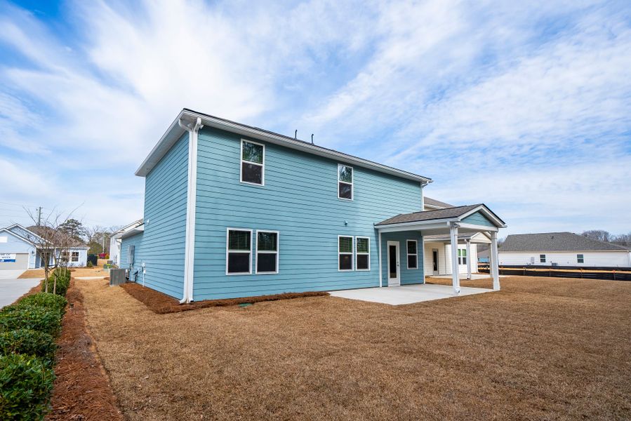 Exterior details and patio area of a home in Monroe Preserve, Chapin (Image 31).