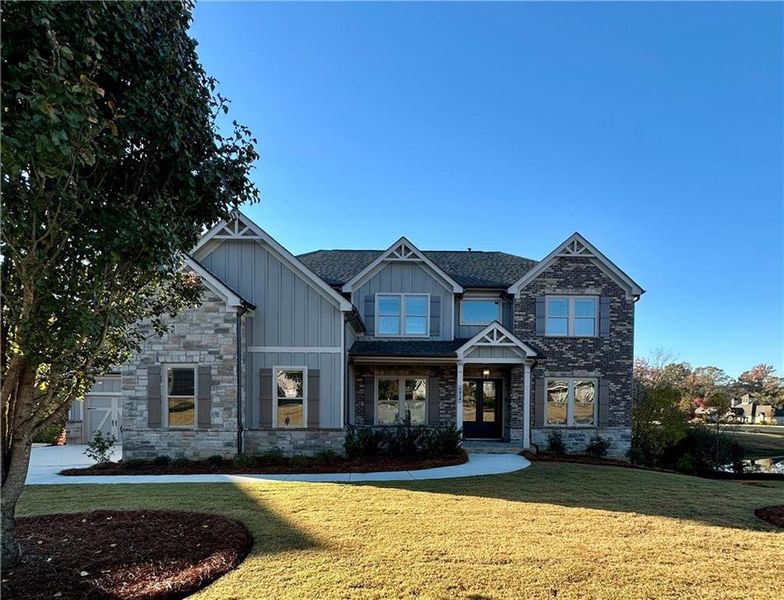 Front exterior of a new home in , Cumming, GA, highlighting curb appeal (Image 1).