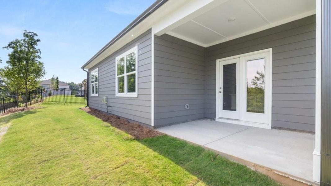 Exterior details and patio area of a home in Falcon Landing, Gainesville (Image 18).