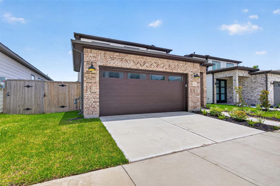 Front exterior of a new home in , Stafford, TX, highlighting curb appeal (Image 1). Front exterior of a new home in , Stafford, TX, highlighting curb appeal (Image 1).