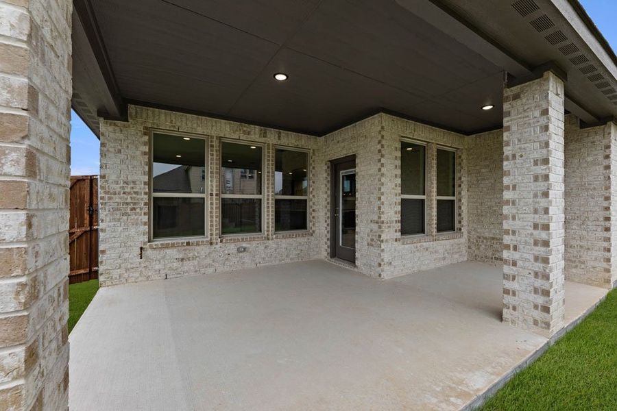Representative exterior photo of a completed home built from the Winchester by Impression Homes in Timberbrook, Justin, TX (Image 26).