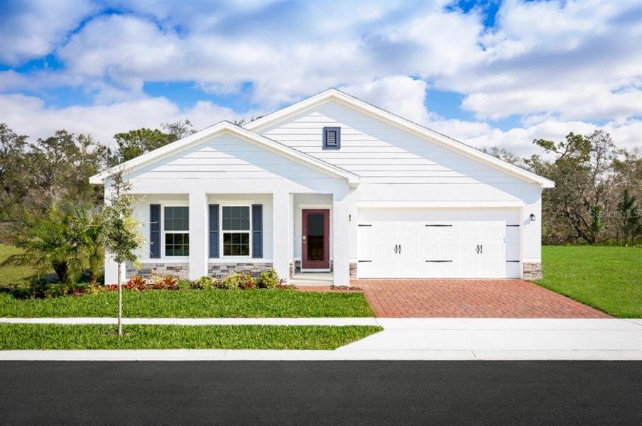 Front exterior of a new home in Laurel Glen, Haines City, FL, highlighting curb appeal (Image 1). Front exterior of a new home in Laurel Glen, Haines City, FL, highlighting curb appeal (Image 1).