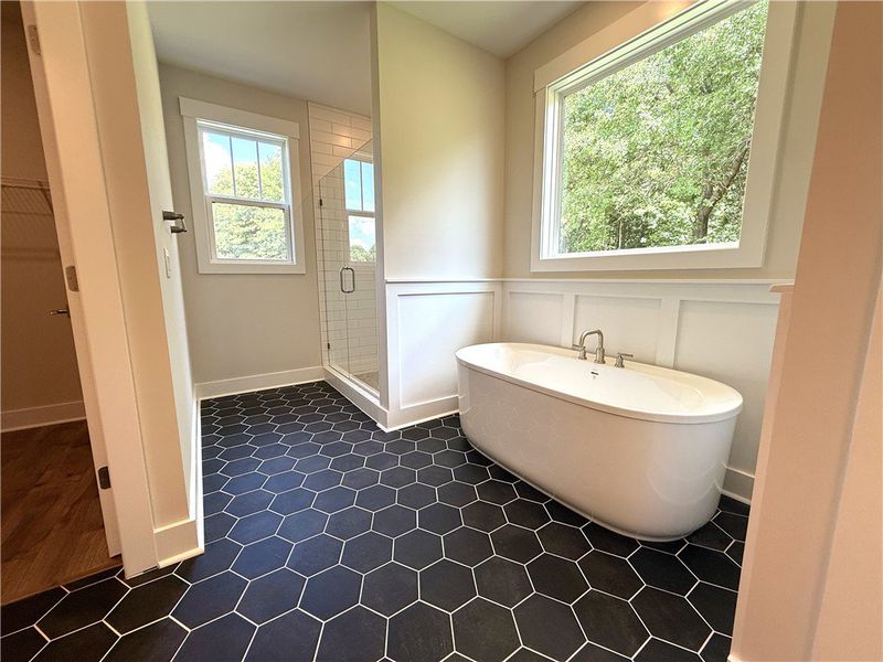 A grand soaking tub and hexagon tile flooring elev A grand soaking tub and hexagon tile flooring elev