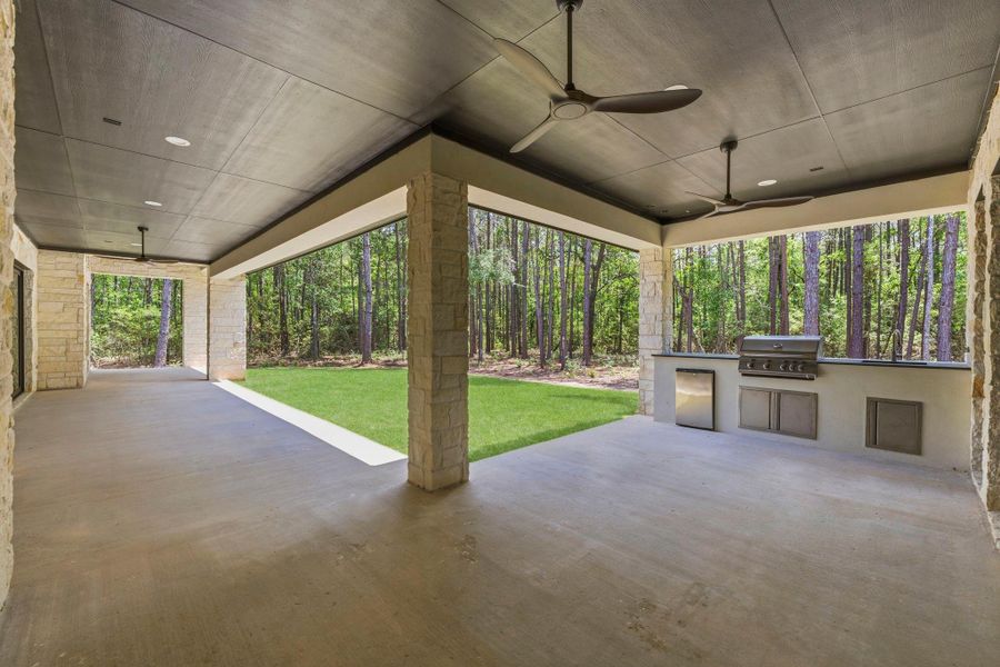 Expansive covered LANAI featuring ceiling fans and generous space for outdoor DINING and hosting!