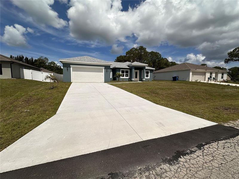 Front exterior of a new home in , Palm Bay, FL, highlighting curb appeal (Image 29). Front exterior of a new home in , Palm Bay, FL, highlighting curb appeal (Image 29).