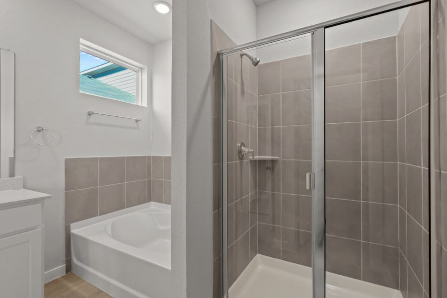 A bathroom with a glass shower.