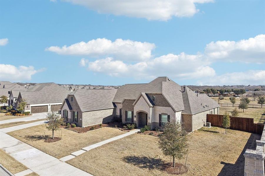 Front exterior of a new home in Gean Estates, Keller, TX, highlighting curb appeal (Image 16).
