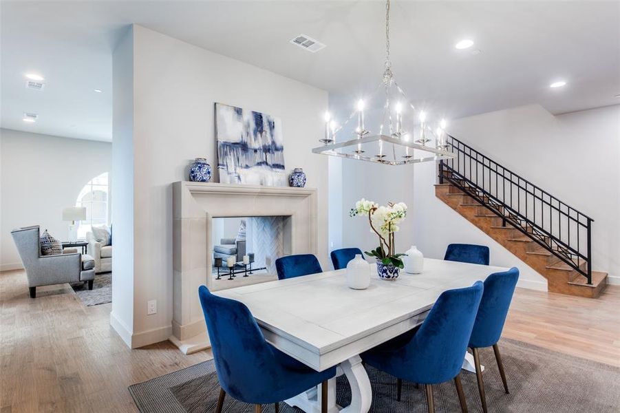 Dining room featuring a notable chandelier and hardwood / wood-style floors