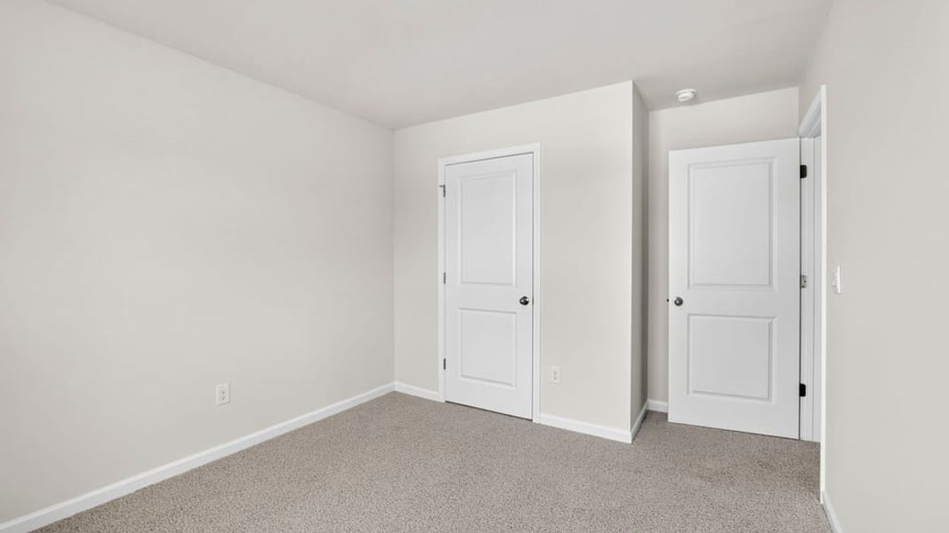 Spacious, unfurnished interior of a new home in Bentley Park, Greenwood (Image 27).