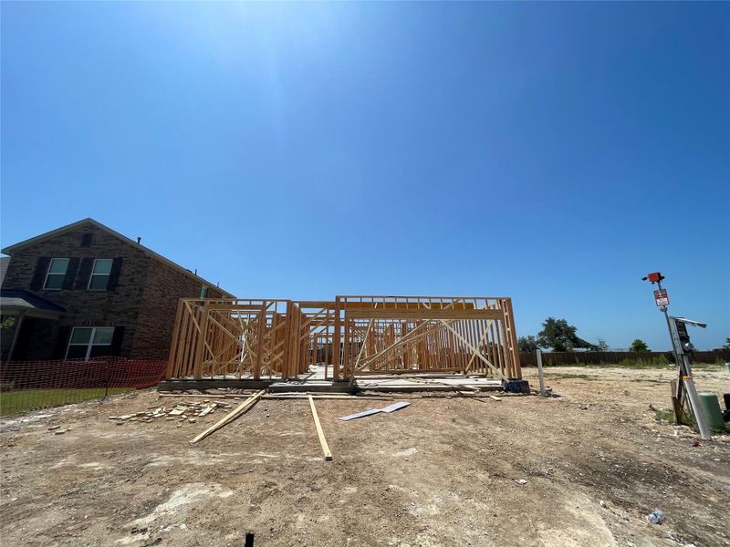 Front exterior of a new home in Berry Creek Highlands, Georgetown, TX, highlighting curb appeal (Image 2). Front exterior of a new home in Berry Creek Highlands, Georgetown, TX, highlighting curb appeal (Image 2).