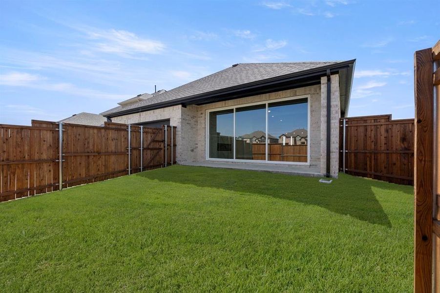 Exterior details and patio area of a home in Villages of Creekwood, Frisco (Image 4).