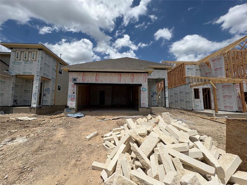 Front exterior of a new home in The Homestead at Lariat, Liberty Hill, TX, highlighting curb appeal (Image 13). Front exterior of a new home in The Homestead at Lariat, Liberty Hill, TX, highlighting curb appeal (Image 13).