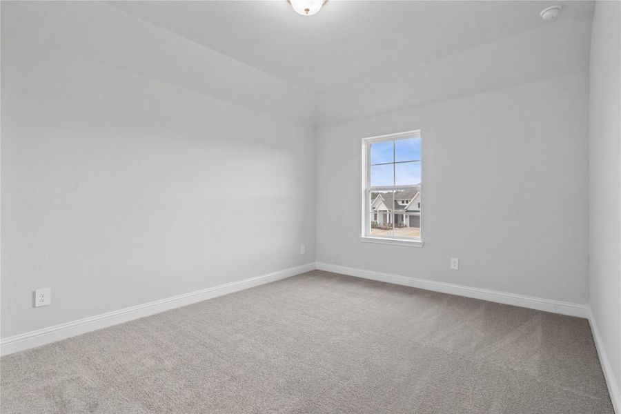 This guest suite, which offers a bright layout with neutral finishes and natural light. Featuring plush carpeting, large window, and an en-suite secondary bathroom.