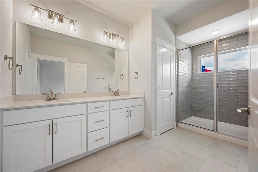 Plenty of storage and counter space in this fantastic owner's bath!