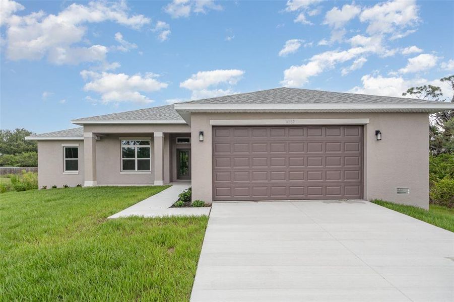 Front exterior of a new home in , Port Charlotte, FL, highlighting curb appeal (Image 1). Front exterior of a new home in , Port Charlotte, FL, highlighting curb appeal (Image 1).