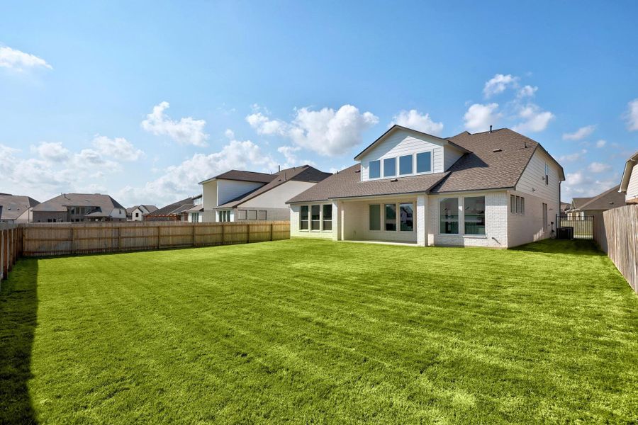 Front exterior of a new home in Santa Rita Ranch - 60', Liberty Hill, TX, highlighting curb appeal (Image 1).