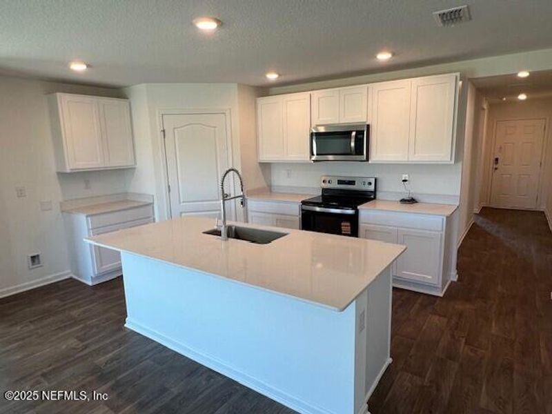 Furnished interior view inside a new home in Sawmill Branch Express, Palm Coast (Image 6).