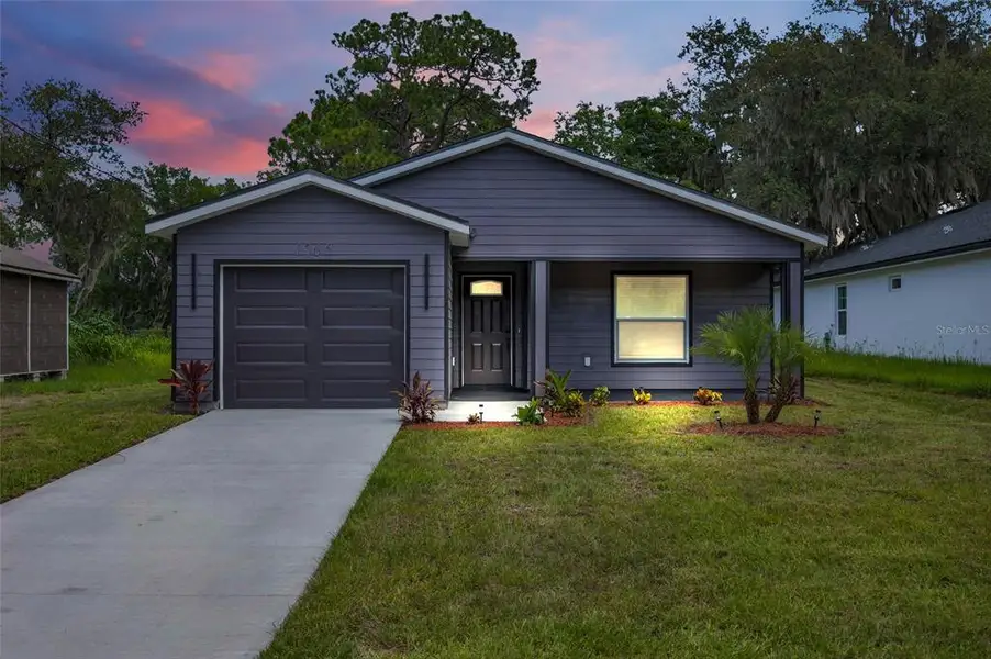 Front exterior of a new home in , Sanford, FL, highlighting curb appeal (Image 1). Front exterior of a new home in , Sanford, FL, highlighting curb appeal (Image 1).