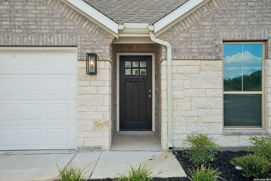 Exterior details and patio area of a home in Prairie Green, Converse (Image 3).