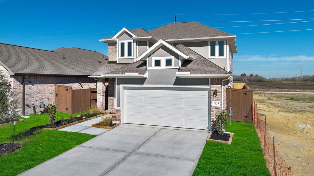 Front exterior of a new home in Creekhaven, Rosharon, TX, highlighting curb appeal (Image 19).