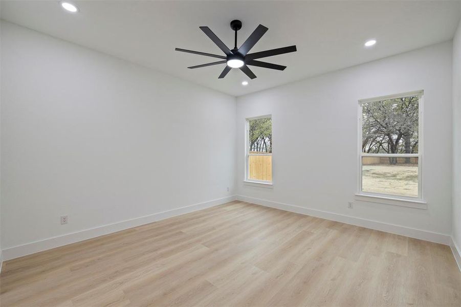 Unfurnished room featuring light wood-type flooring, recessed lighting, and a ceiling fan