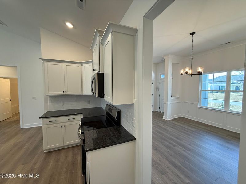 Furnished interior view inside a new home in Wood Creek Landing, Leland (Image 9).