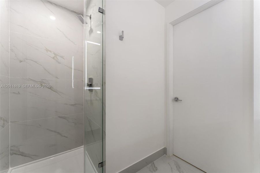 Elegant secondary bathroom with high-end European fixtures, modern vanity, and curated finishes consistent with Aria Reserve’s luxury design standards.