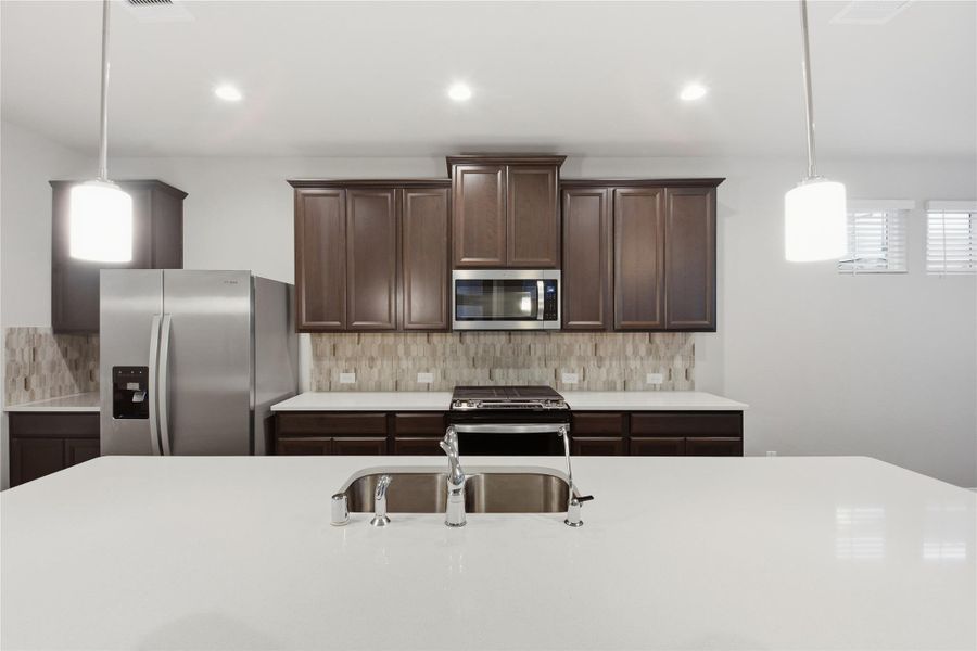 Gorgeous dark features and tile backsplash! Gorgeous dark features and tile backsplash!