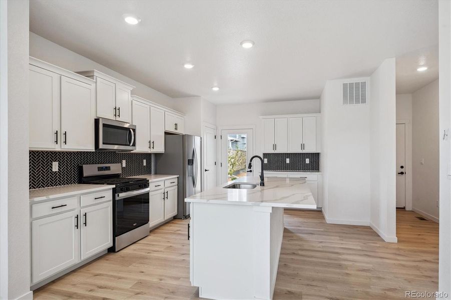 Furnished interior view inside a new home in Horizon Uptown, Aurora (Image 9).