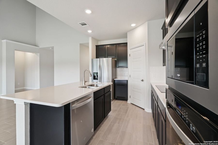 Furnished interior view inside a new home in Legendary Trails - Classic Series, Cibolo (Image 11). Furnished interior view inside a new home in Legendary Trails - Classic Series, Cibolo (Image 11).