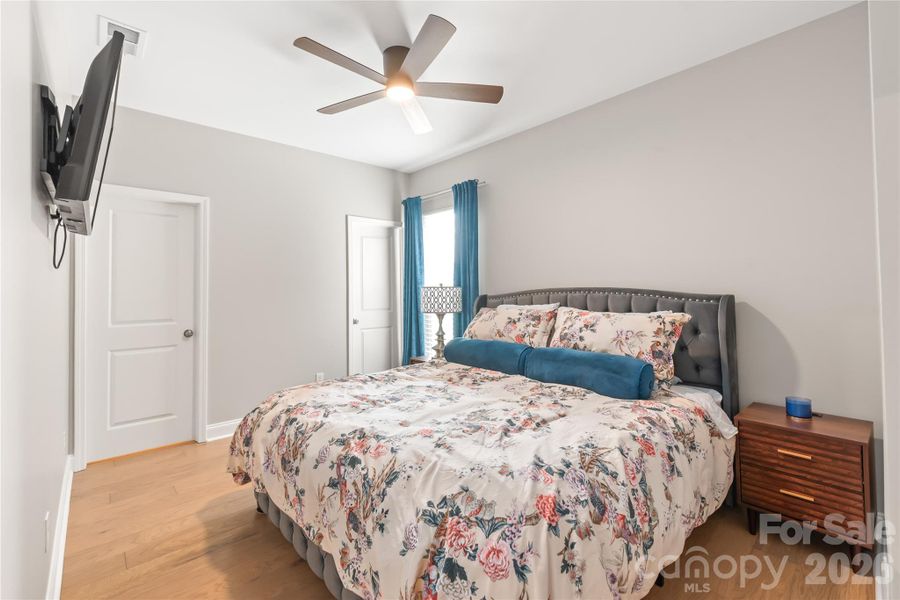 Main level guest room with a walk-in closet and an ensuite bath.
