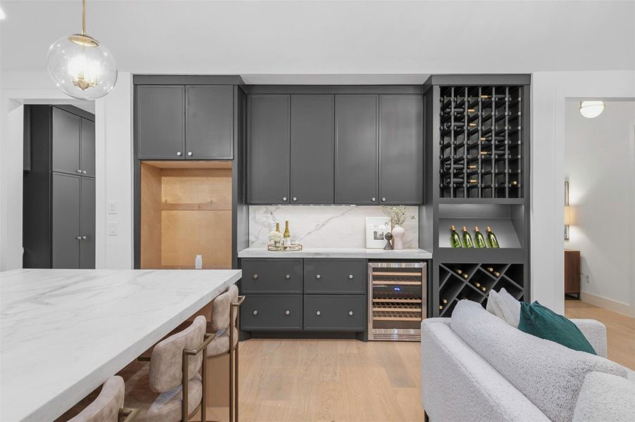 Hidden outlet strips beneath the cabinetry keep countertops clean and uncluttered while still giving you easy access to power exactly where you need it.
