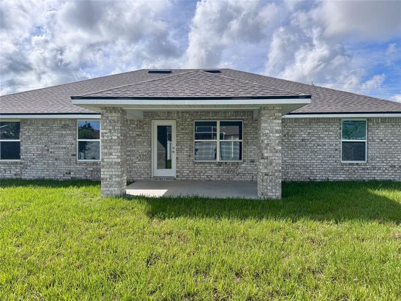 Front exterior of a new home in Palm Coast, Palm Coast, FL, highlighting curb appeal (Image 2). Front exterior of a new home in Palm Coast, Palm Coast, FL, highlighting curb appeal (Image 2).