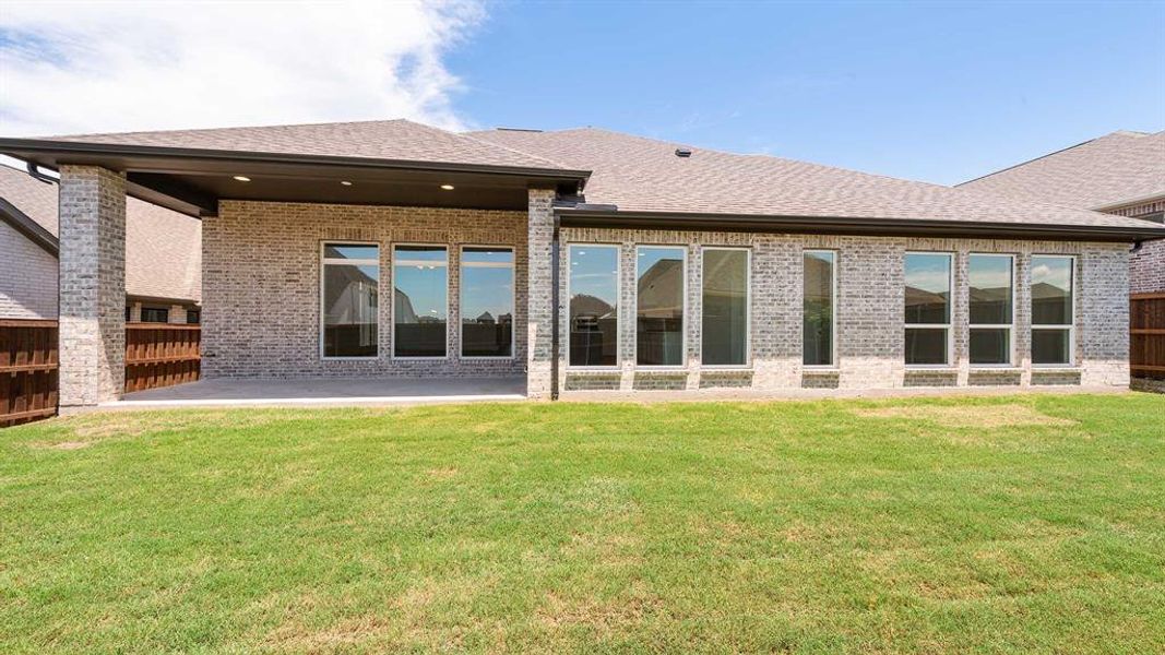 Front exterior of a new home in Hillstead 60', Lavon, TX, highlighting curb appeal (Image 2).