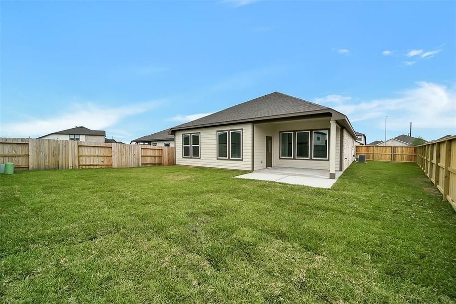 Front exterior of a new home in Sunterra, Katy, TX, highlighting curb appeal (Image 53).