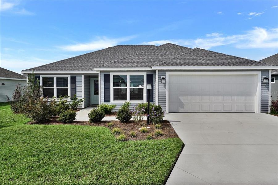 Front exterior of a new home in , The Villages, FL, highlighting curb appeal (Image 2). Front exterior of a new home in , The Villages, FL, highlighting curb appeal (Image 2).