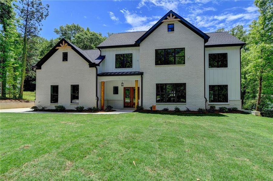 Front exterior of a new home in , Snellville, GA, highlighting curb appeal (Image 23). Front exterior of a new home in , Snellville, GA, highlighting curb appeal (Image 23).