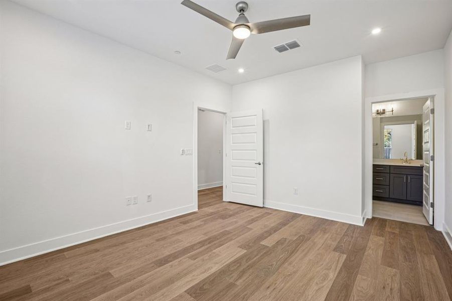 The primary suite features its own ensuite and walk-in closet. (Sample photoof finishes and layout)