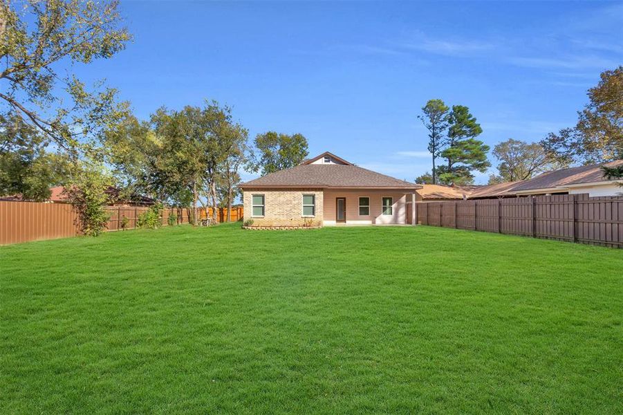 Back of house with a patio area and a fenced backyard