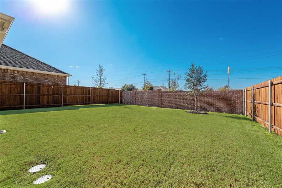 Exterior details and patio area of a home in Walden Pond, Forney (Image 22).