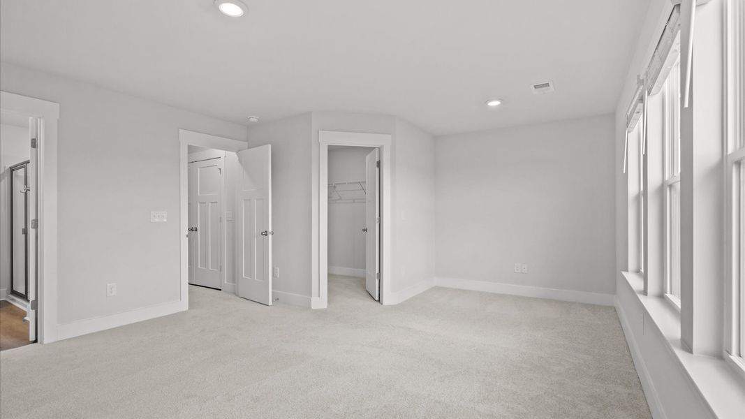 Memorable mornings begin in this tasteful and thoughtfully crafted primary suite