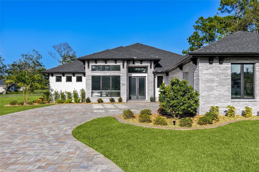 Front exterior of a new home in , New Smyrna Beach, FL, highlighting curb appeal (Image 24). Front exterior of a new home in , New Smyrna Beach, FL, highlighting curb appeal (Image 24).