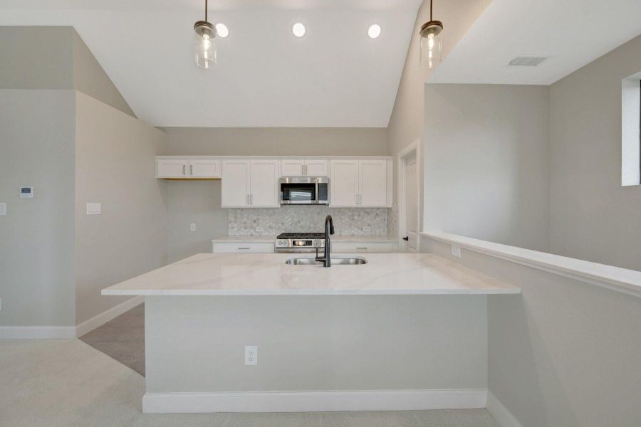 Furnished interior view inside a new home in Riceland - Enclave Row Collection, Mont Belvieu (Image 9).