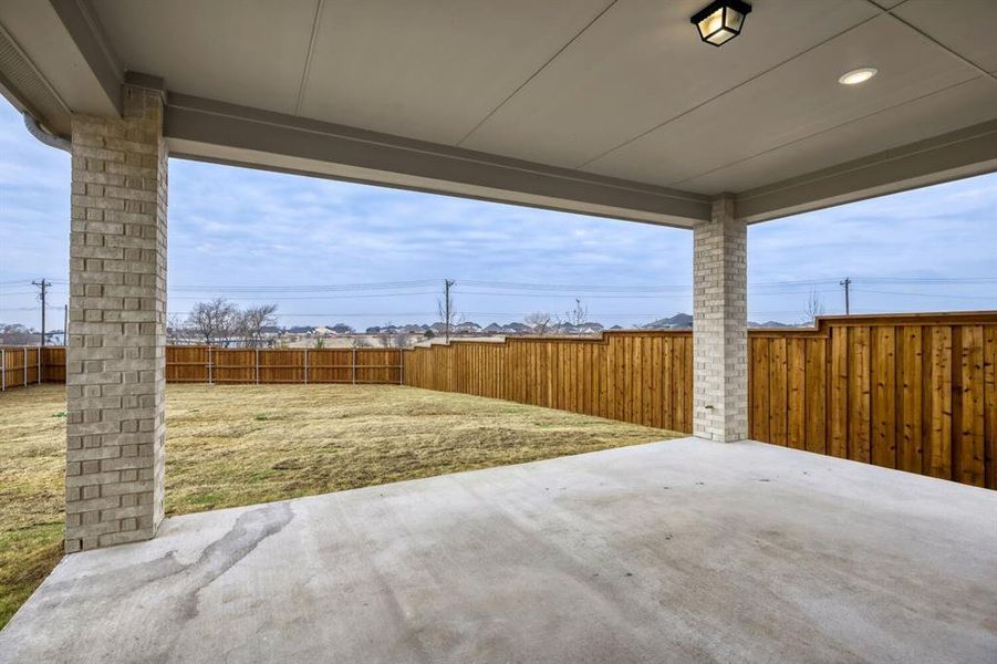 Fenced backyard featuring a patio area