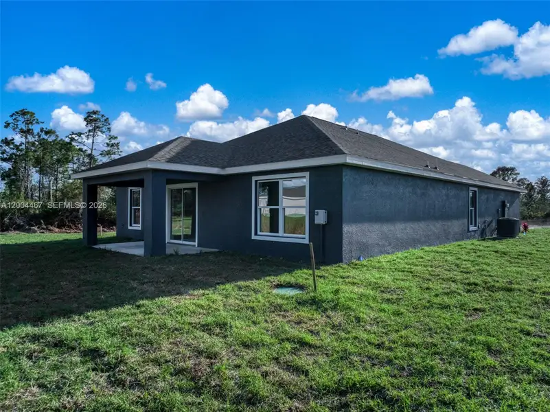 Exterior details and patio area of a home in , Sebring (Image 3).