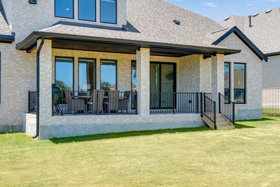 A spacious covered patio provides an ideal setting for outdoor enjoyment with ample green space. A spacious covered patio provides an ideal setting for outdoor enjoyment with ample green space.