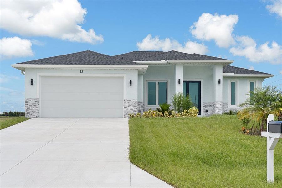 Front exterior of a new home in , Placida, FL, highlighting curb appeal (Image 28).