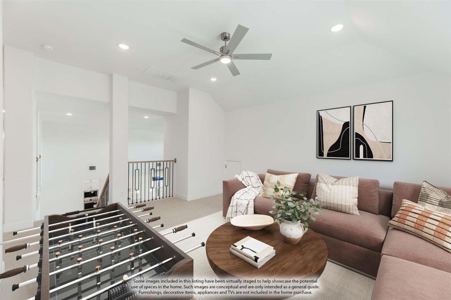 Upstairs game room with foosball table, sectional sofa, ceiling fan, and staircase railing visible in background