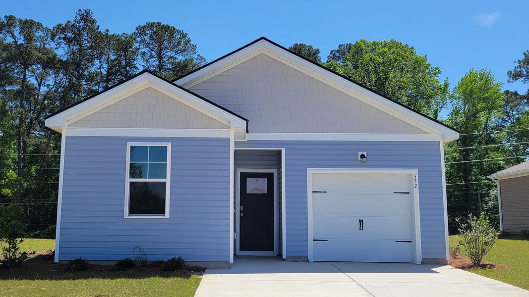Front exterior of a new home in The Bluffs at Mill Creek, Florence, SC, highlighting curb appeal (Image 1).